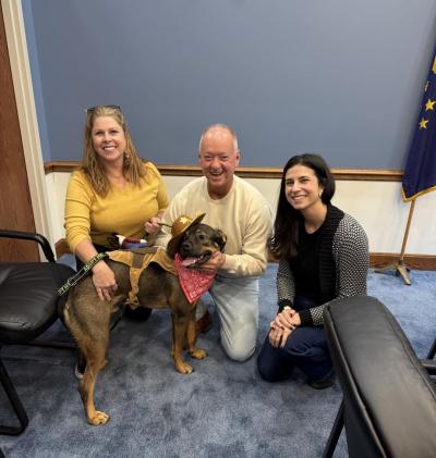 Jeffersonville Animal Shelter staff with a dog wearing a cowboy hat and bandanna